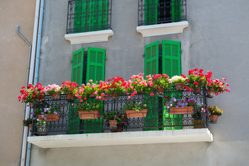 Fototapeta na wymiar French balcony with flowers