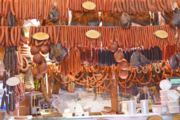 Showcase with sausages and sausage products