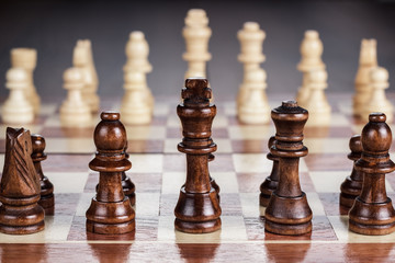 chess board with figures on the wooden table