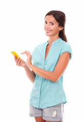 Fashionable girl texting message on mobile phone