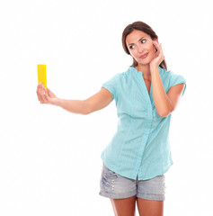Attractive female taking photos of herself