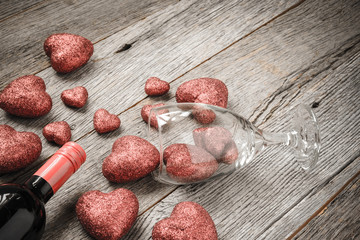 Wine Glass and bottle of Wine with Red Hearts on Valentine's Day