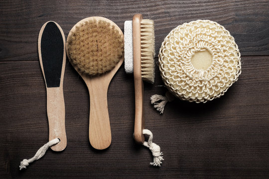 some bath accessories on brown wooden background