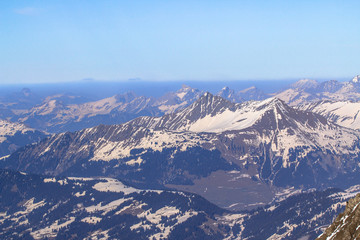 Alpine landscape with peaks covered by snow