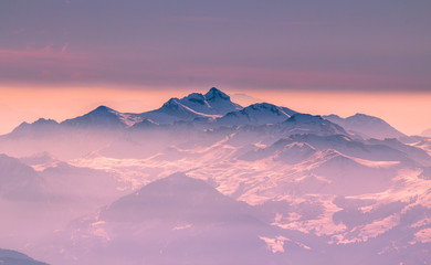 Alpine landscape with peaks covered by snow