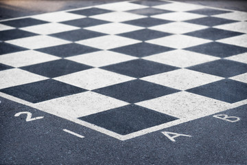 chess board on asphalt