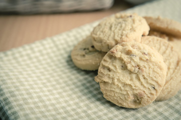 Close up of cookies on green check clothtable