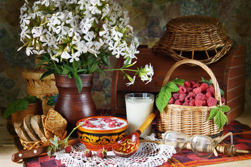 Rural still life with raspberries and milk