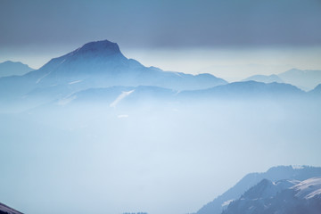 Fototapeta na wymiar Alpine landscape with peaks covered by snow
