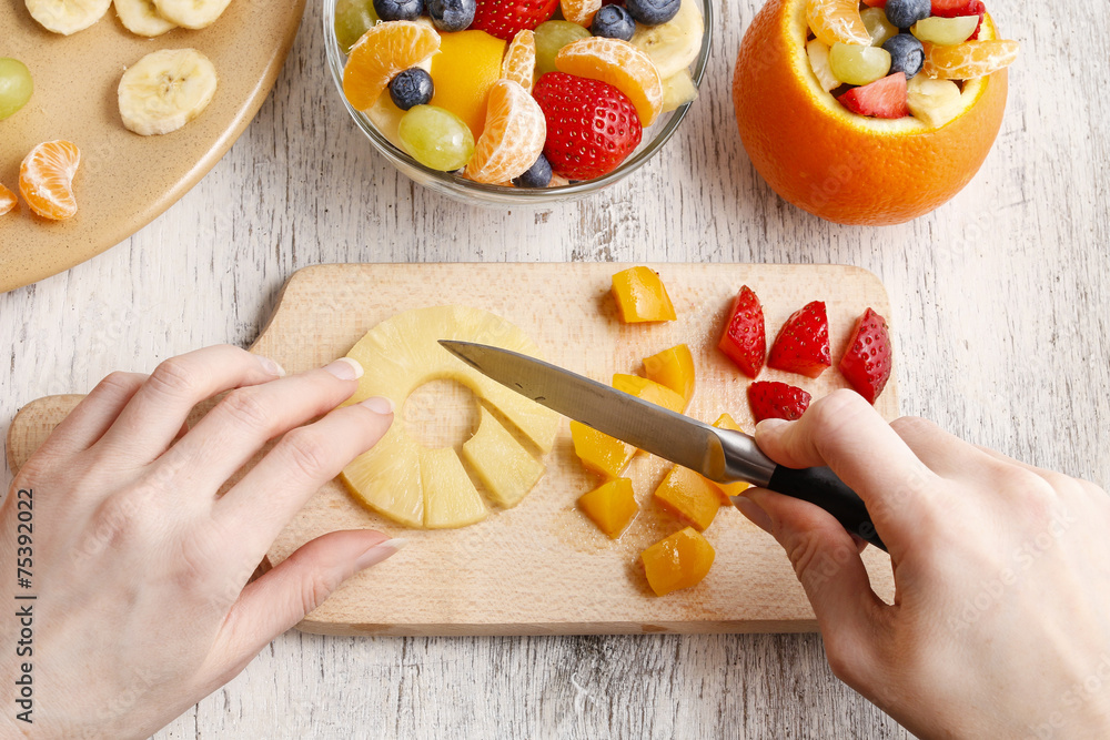 Wall mural orange filled with fruit salad