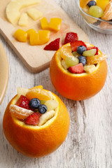 Orange filled with fruit salad