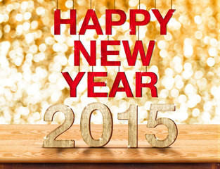 Happy New Year 2015 on wood table with sparkling