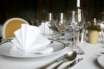 Fine dining table, plate wine glasses and cutlery