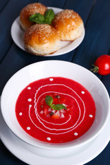 Gazpacho soup on color wooden background