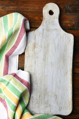 Empty cutting board on wooden background