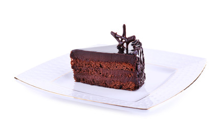 Delicious chocolate cake on plate isolated on white