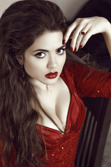 Beautiful Young Woman with red lips, expressive eyes. Vintage St