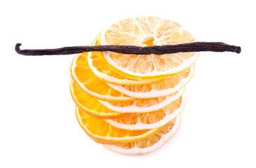 Pile of dried orange with vanilla bean isolated on white
