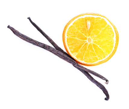 Dried orange with vanilla beans isolated on white