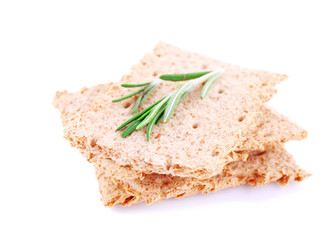 Crispbread with sprigs of rosemary isolated on white background