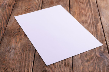 Paper sheet on table close-up - obrazy, fototapety, plakaty