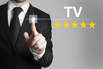 businessman pushing button tv five rating stars