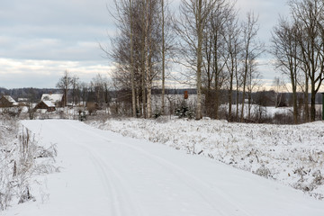 Fototapeta na wymiar country snowy road in winter