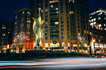 Traffic circle and modern buildings at night in Baltimore, Maryl
