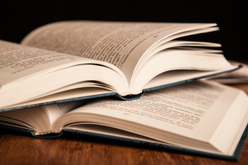 stack of open books