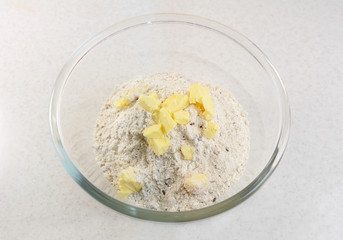 Adding butter to a bread mix