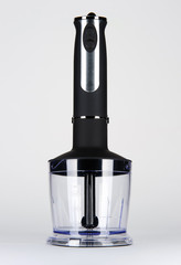 Manual blender with plastic bowl. Kitchen electric equipment.