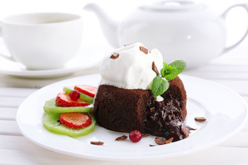 Hot chocolate pudding with fondant centre with ice-cream,