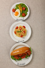 Menu of day. Plates with food on table