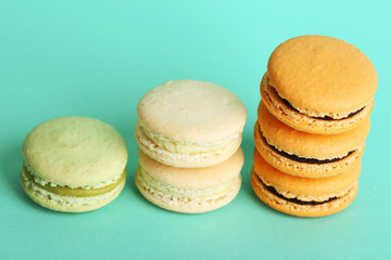 Gentle colorful macaroons on color background