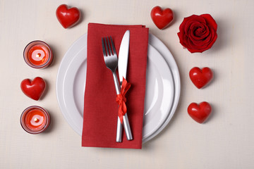 Fototapeta na wymiar Festive table setting for Valentines Day on light background