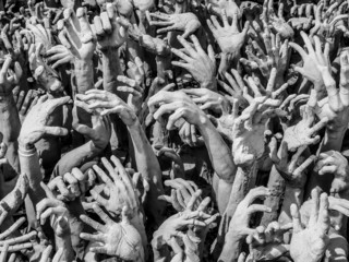 hands from the hell at Wat Rong Khun temple, Thailand