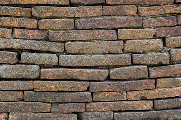 Naklejka premium Ancient brick wall in Chiang Mai, northern Thailand