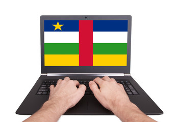 Hands working on laptop, Central African Republic