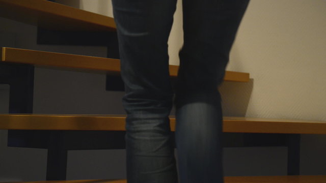 couple undressing on stairs