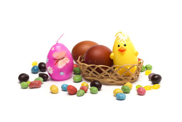 Happy Easter. Rabbit with Easter eggs and candies.