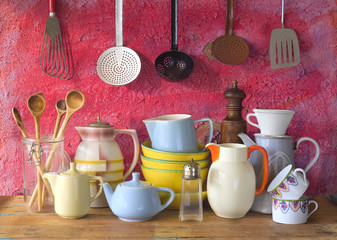 collection of vintage kitchenware, red background
