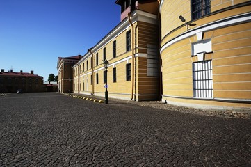 Cobbled Street and Yellow Building