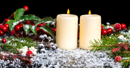 Christmas card of decorated evergreen branches, red leaves, berr