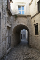 Fototapeta na wymiar Pavement end narrow streets and courtyards of Trogir,Croatia