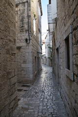 Fototapeta na wymiar Pavement end narrow streets and courtyards of Trogir,Croatia
