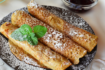 Crepes With Strawberry Jam On The Brown Plate. Pancakes.