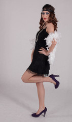 Young sexy girl posing in flapper style dress