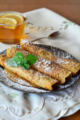 Sweet Crepes With Strawberry Jam With Cup Of Tea.