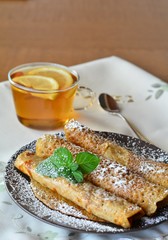 Sweet Crepes With Strawberry Jam With Cup Of Tea.