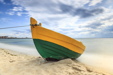 Wooden boat on The Baltic shore.